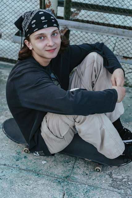 teen boy on skateboard